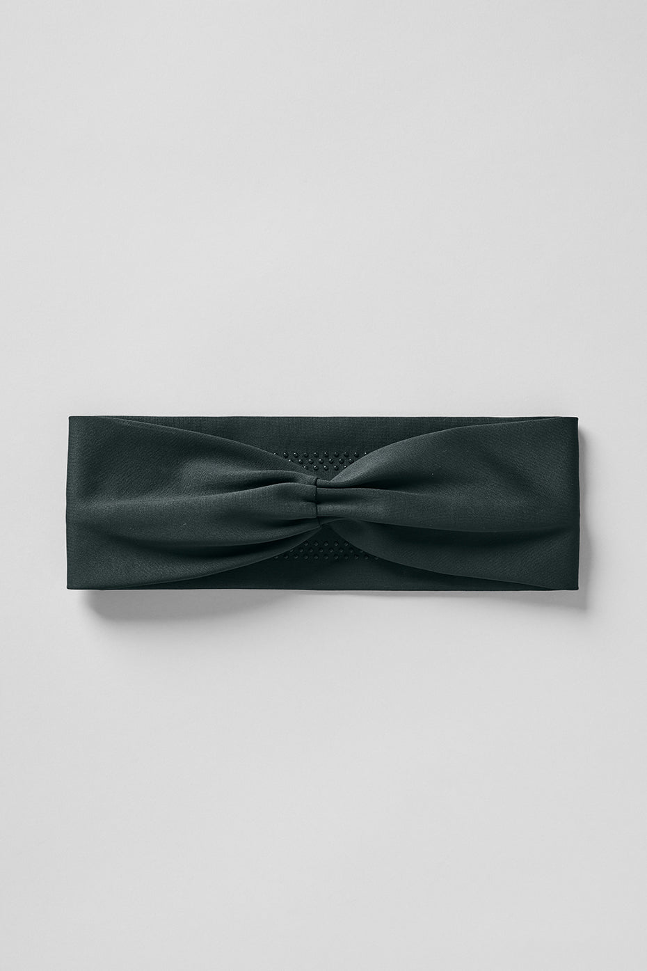 Side view of the headband during a run, highlighting sweat-wicking fabric.