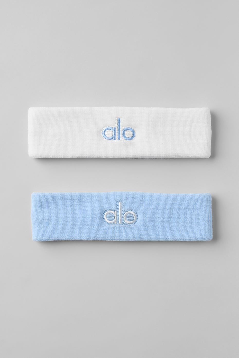 Close-up of seashell blue glow athletic headbands for men.