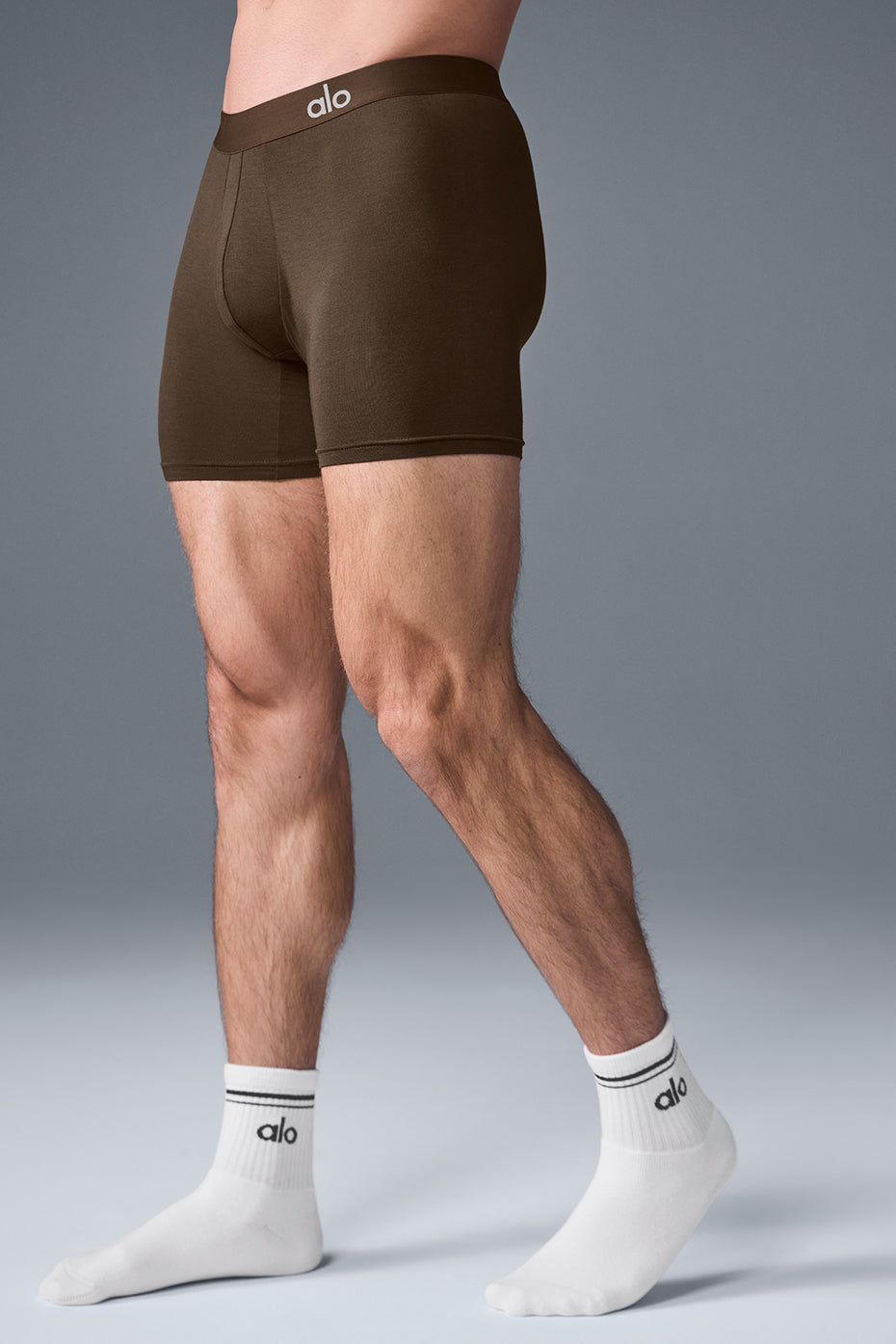 Model wearing espresso boxer shorts, demonstrating comfort and fit during daily activities.