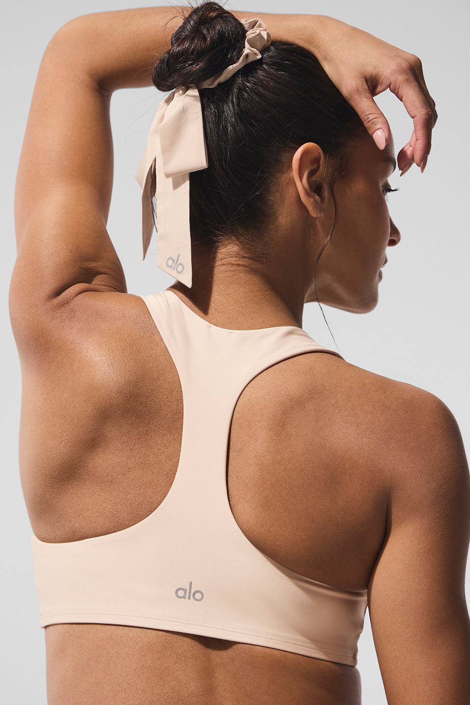 Close-up of macadamia bow scrunchie, showcasing its elegant design.
