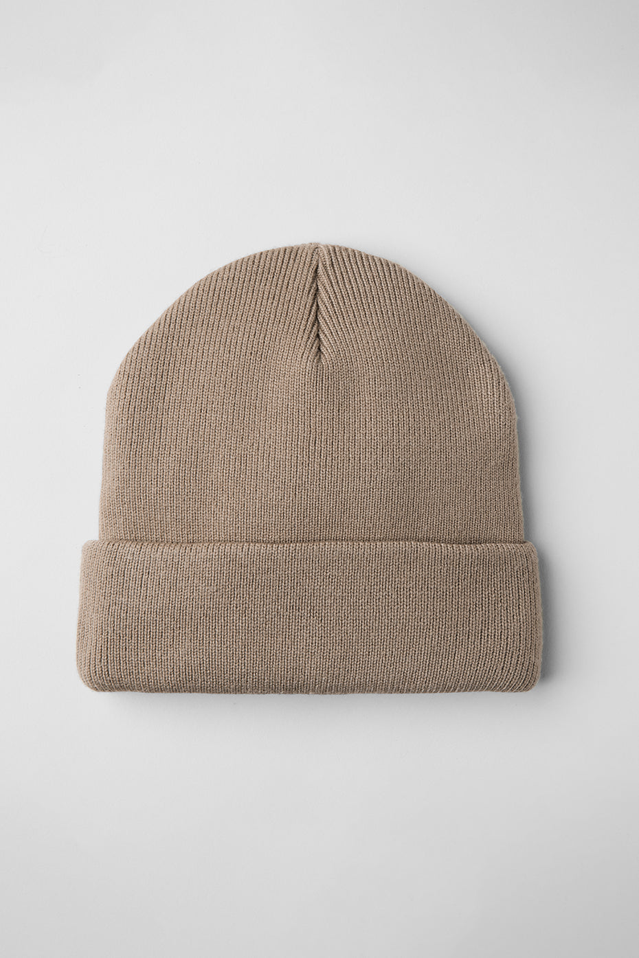 Close-up of the fabric texture of the wool beanie, highlighting its cozy warmth.