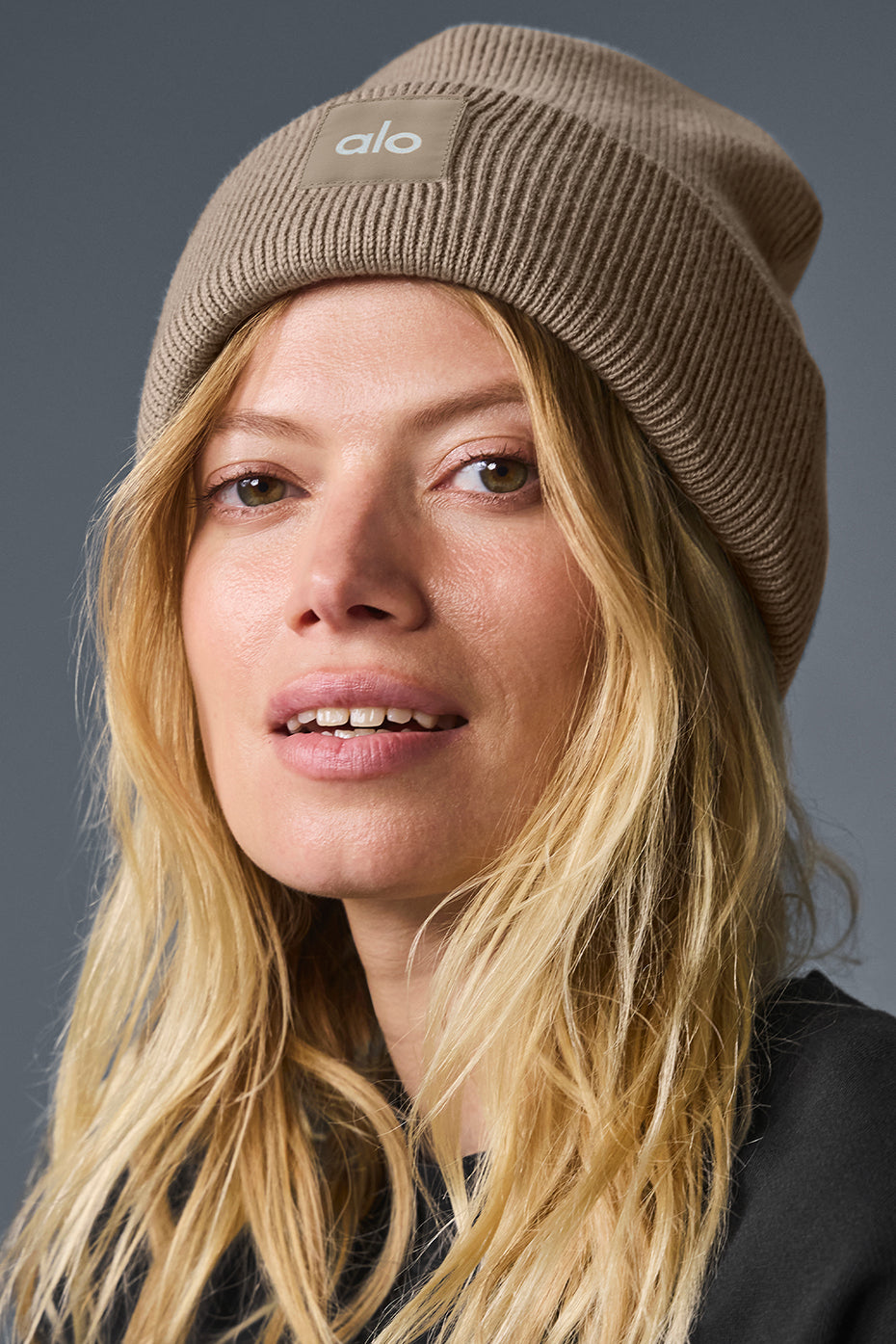 Man wearing a warm wool beanie, showcasing its relaxed style with casual attire.