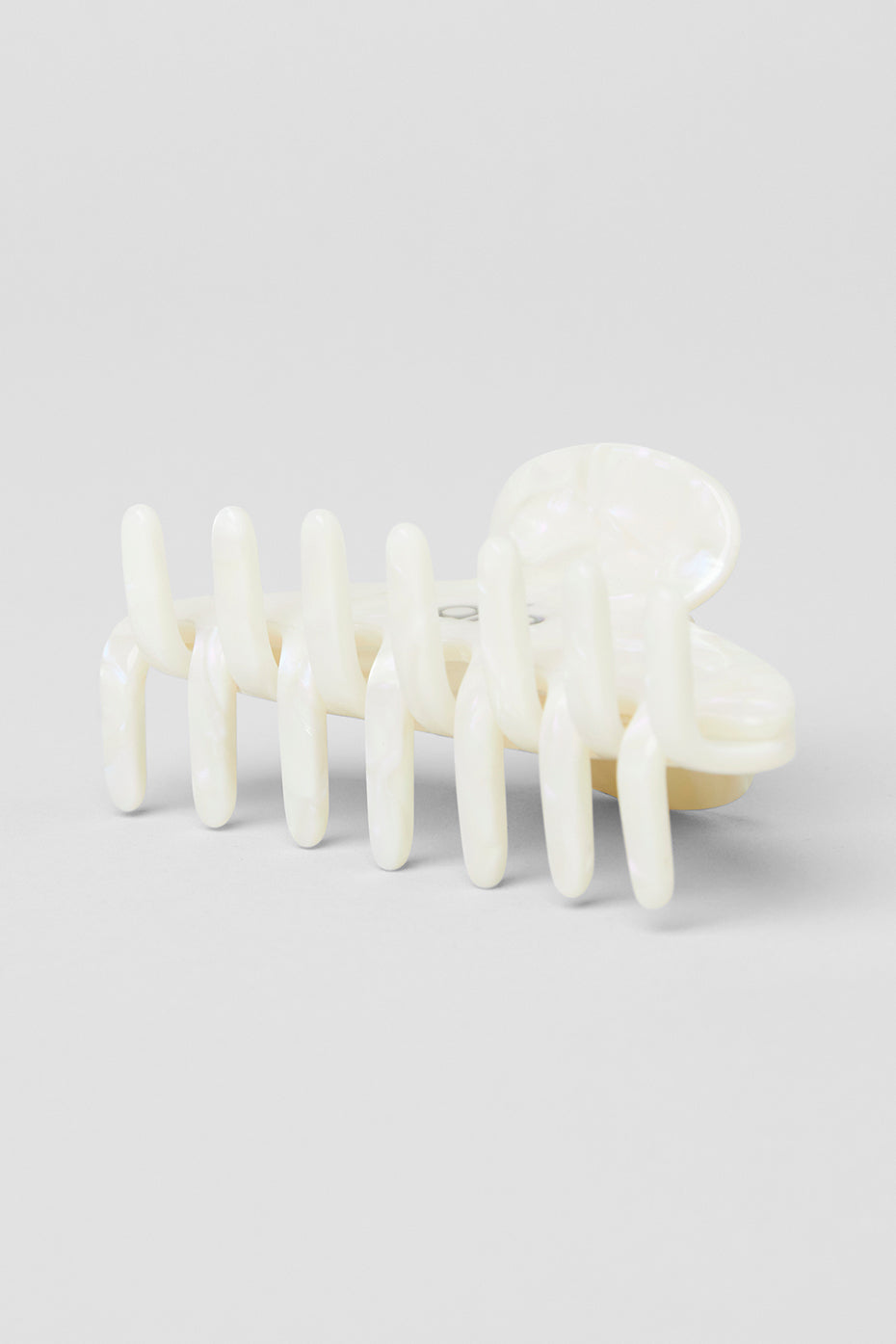 Fashionable pearl claw clip styled with a casual outfit outdoors