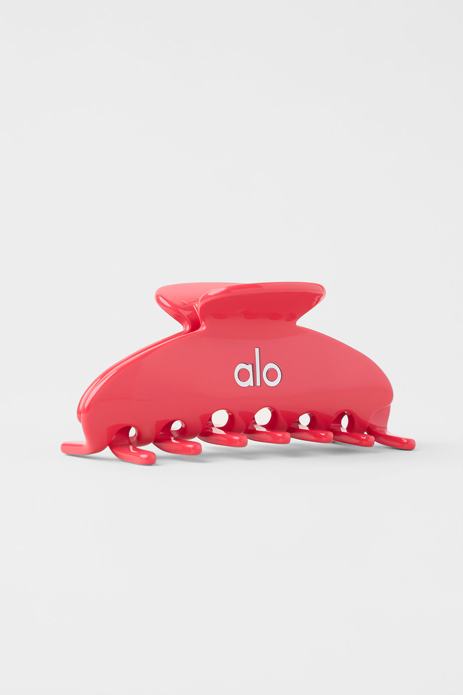 Bright candy red 90's claw clip in a stylish updo for everyday wear