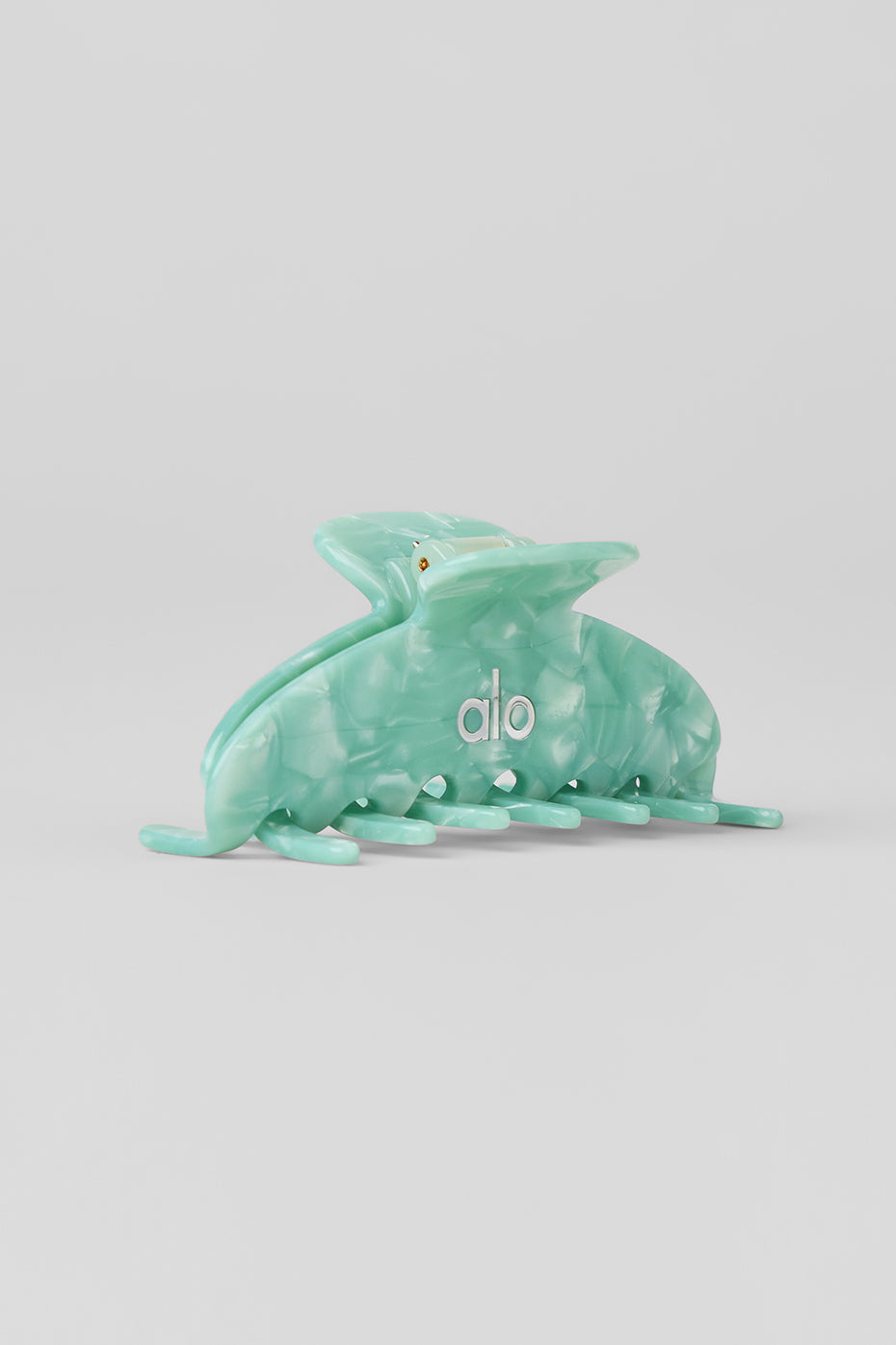 Close-up of spearmint marble hair claw clip showcasing its design.