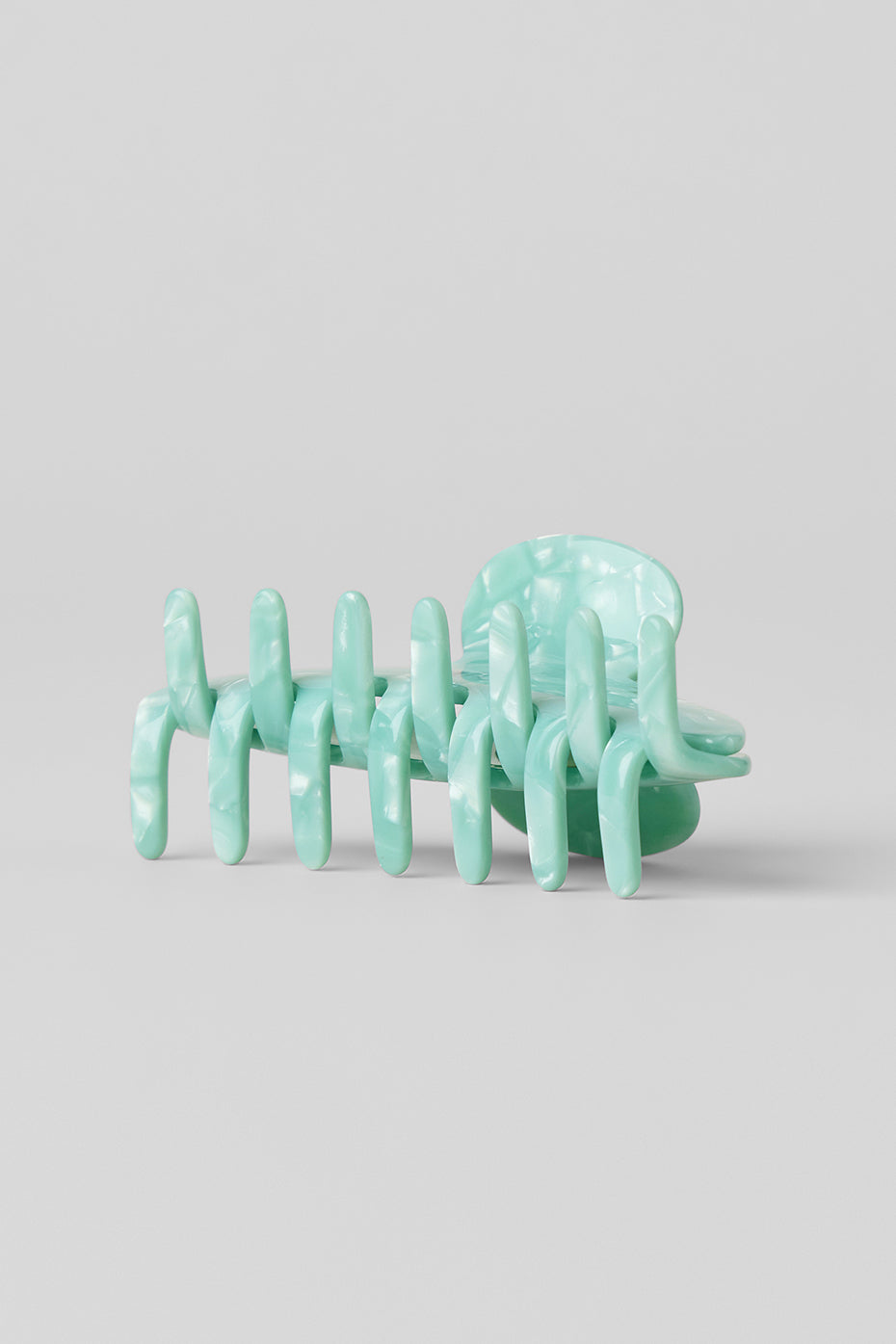 Close-up of spearmint marble hair claw clip showcasing its design.