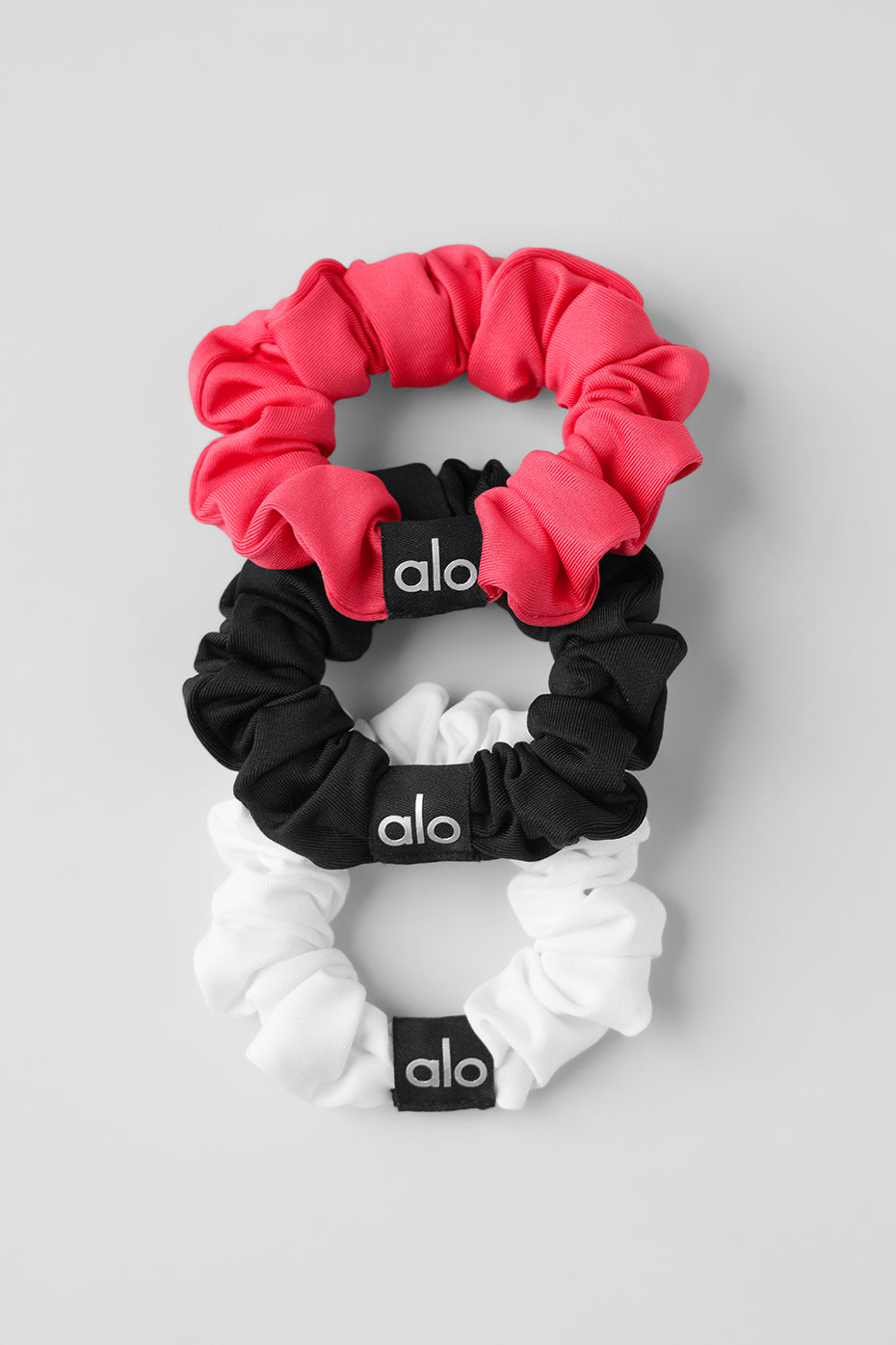 Candy red mini scrunchie from the chic trio, perfect for adding style to any outfit.