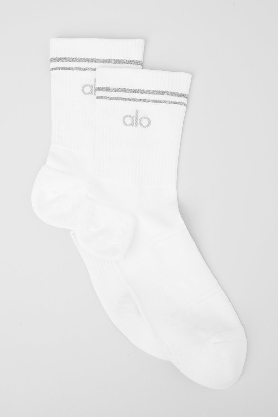 Close-up of unisex performance running socks showcasing reflective logo.
