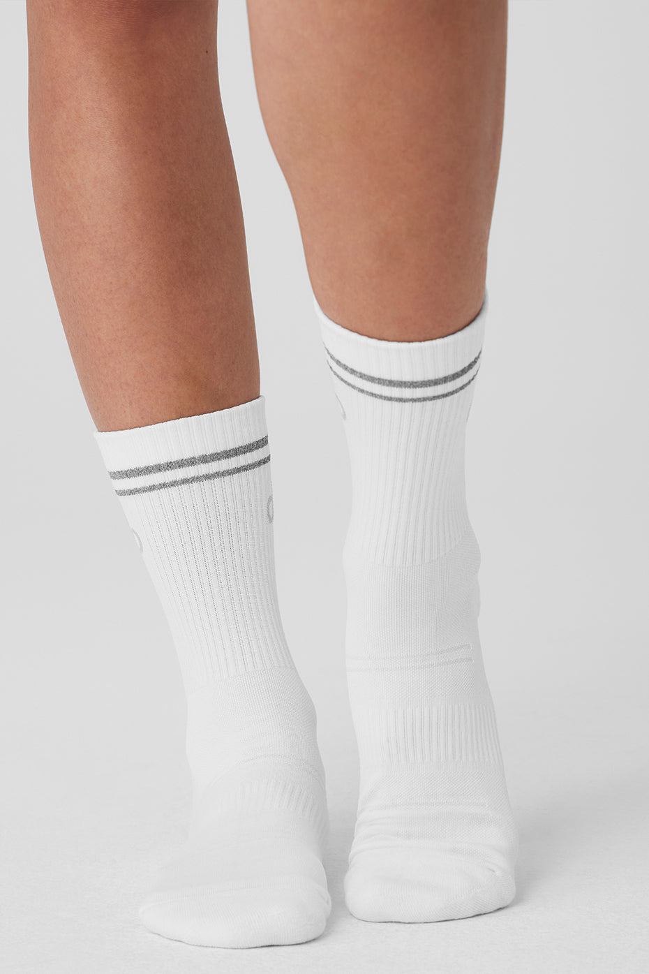Detail of the ribbed ankle and midfoot design of performance socks.