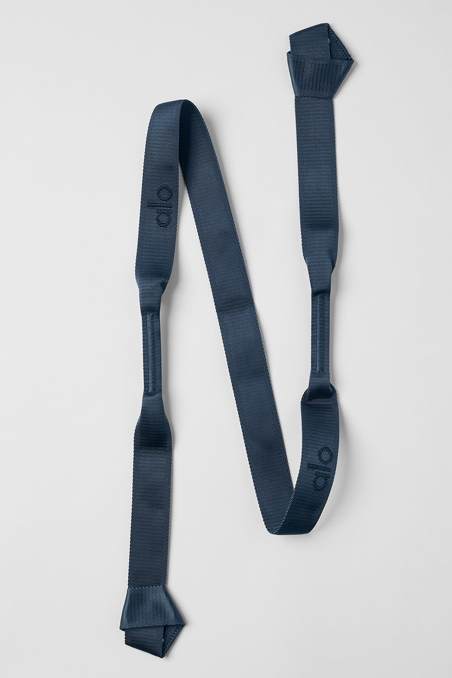 Close-up of Eclipse yoga strap laid out for stretching exercises