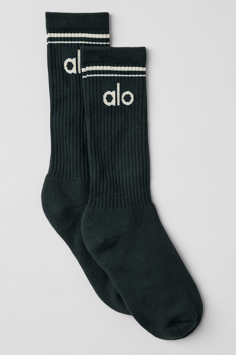 Close-up of sock texture and stripe detail in charcoal green and ivory