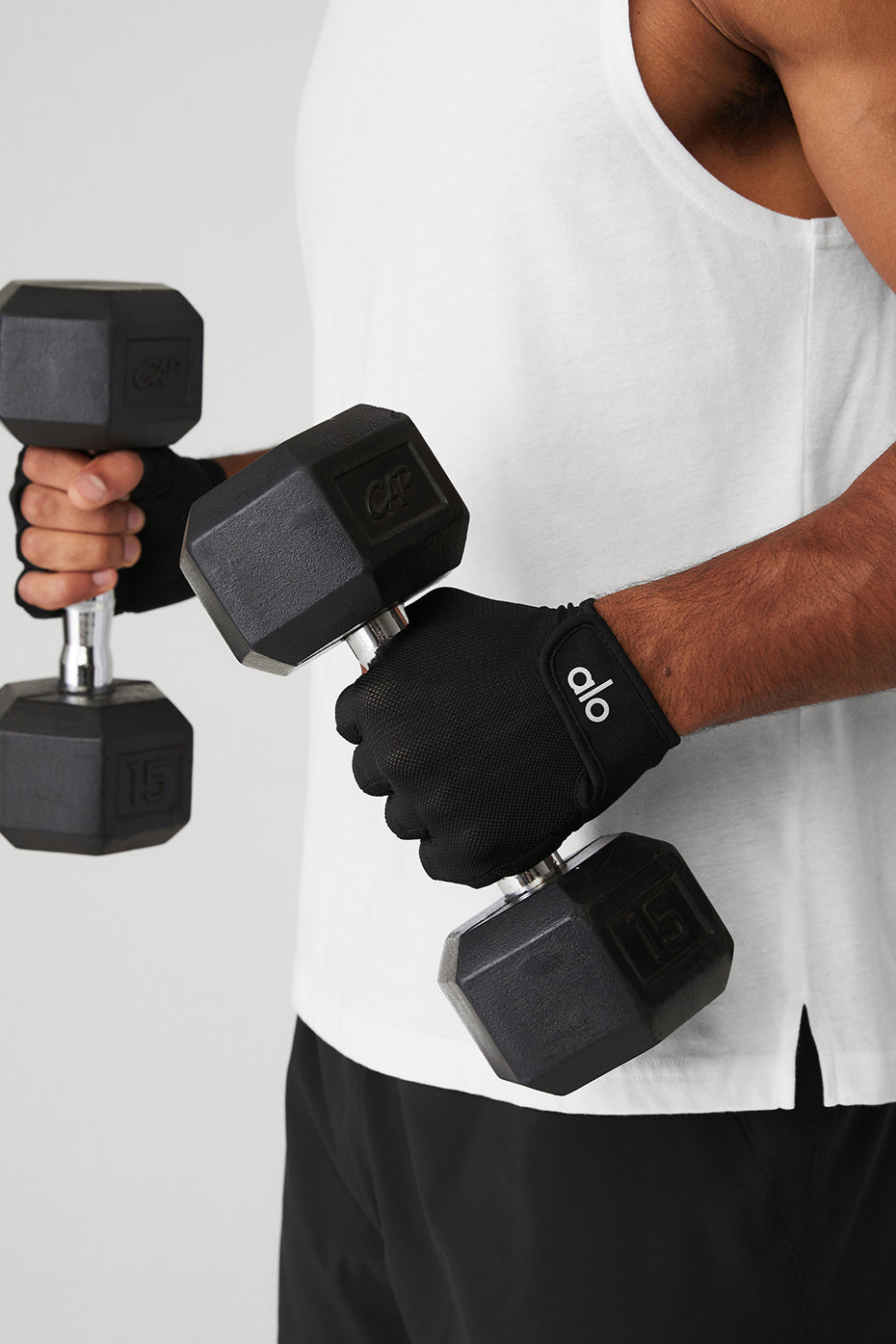 Athlete wearing workout gloves during a weight training session.