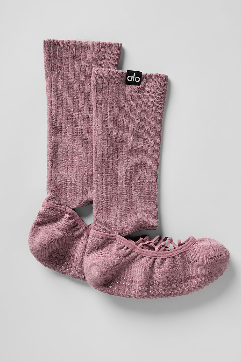 Side view of grip socks pilates style with crew-length fit and elastic straps