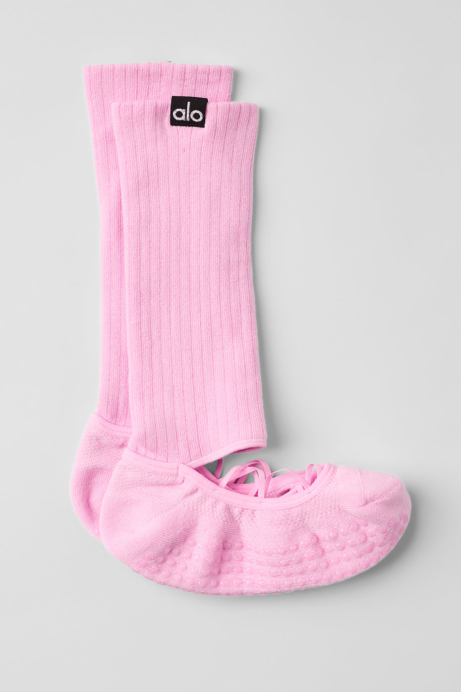 Close-up of cushioned soles and elastic cross-strap design on grip socks