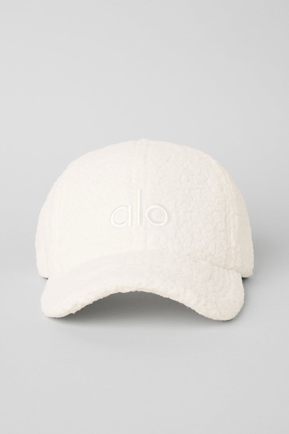 Casual outfit paired with the cozy sherpa cap on a chilly day.