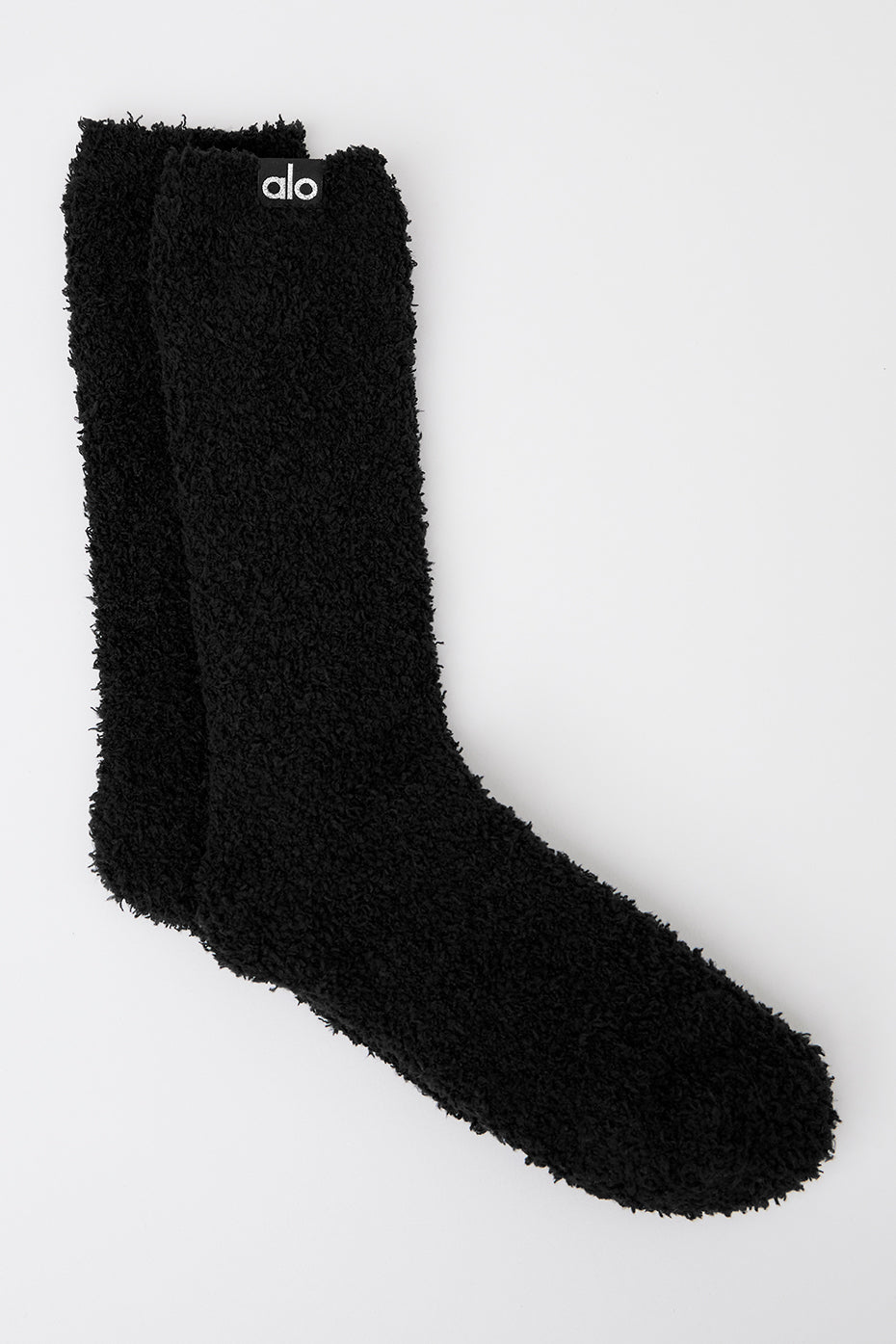 Black plush socks for women, showcasing their soft texture.