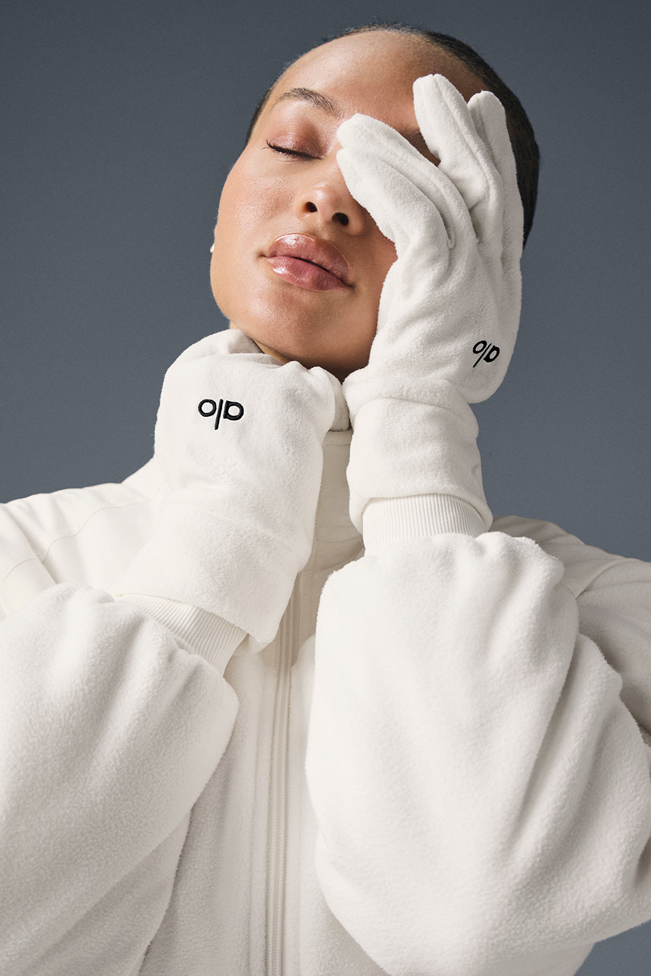 Person wearing warm work gloves while enjoying a winter hike.