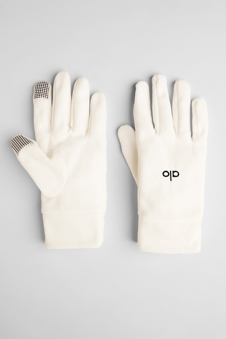 Close-up of ivory fleece gloves showcasing soft texture and warmth.