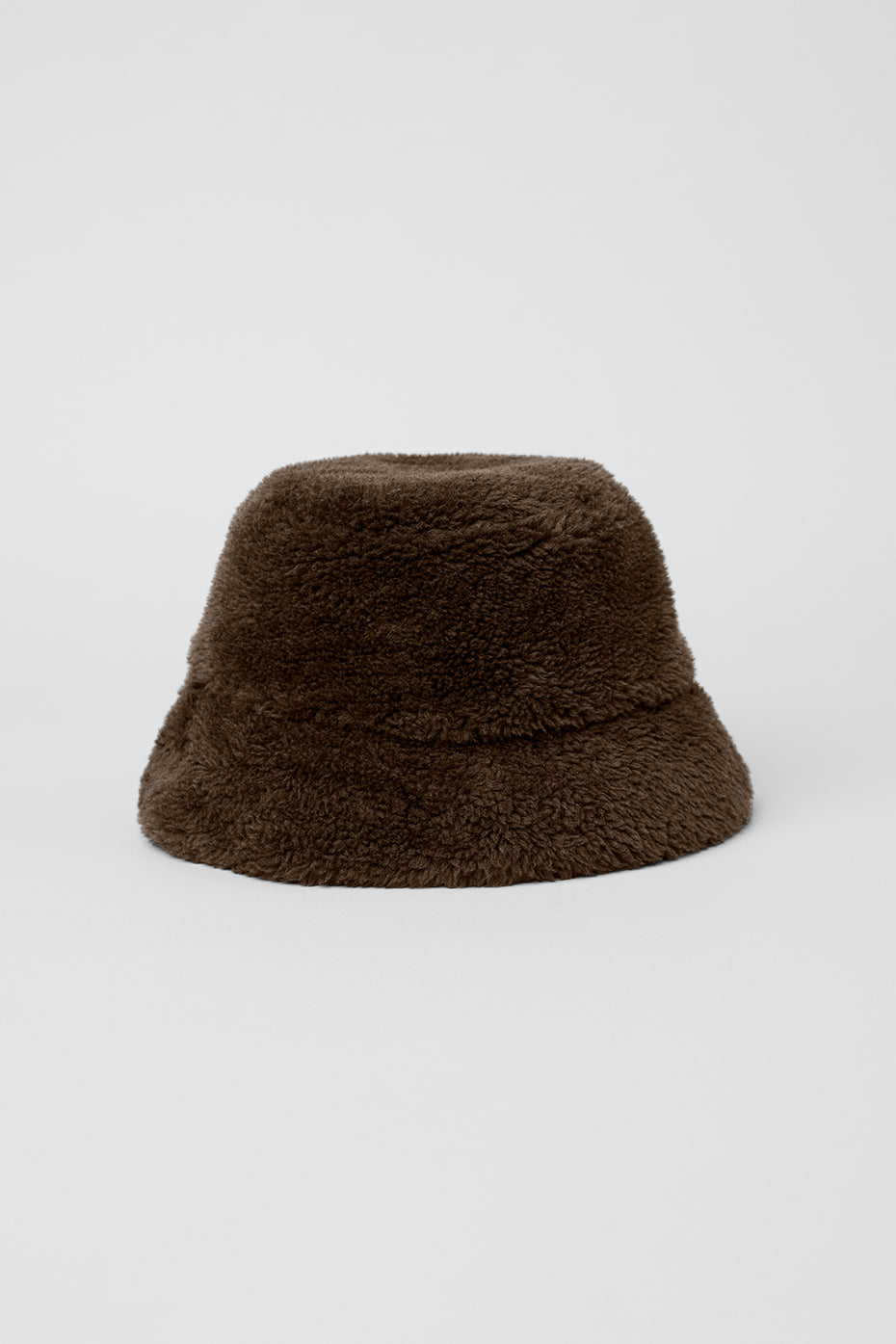 Model wearing a Sherpa bucket hat in winter setting, highlighting cozy style