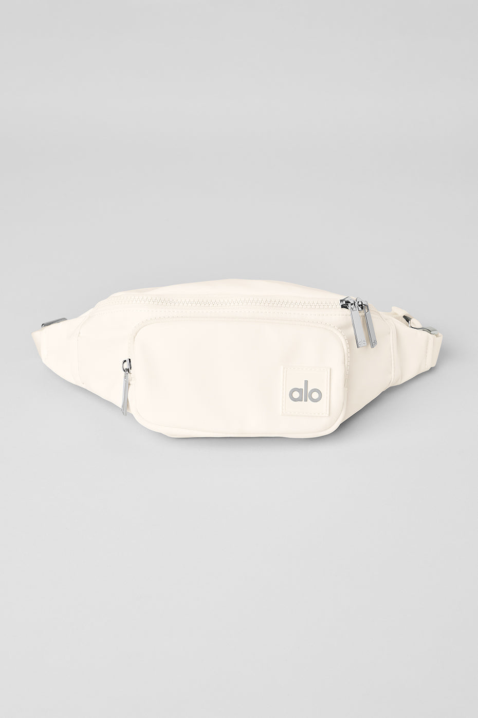Front view of the Explorer Ivory Fanny Pack with zip pockets and nylon material
