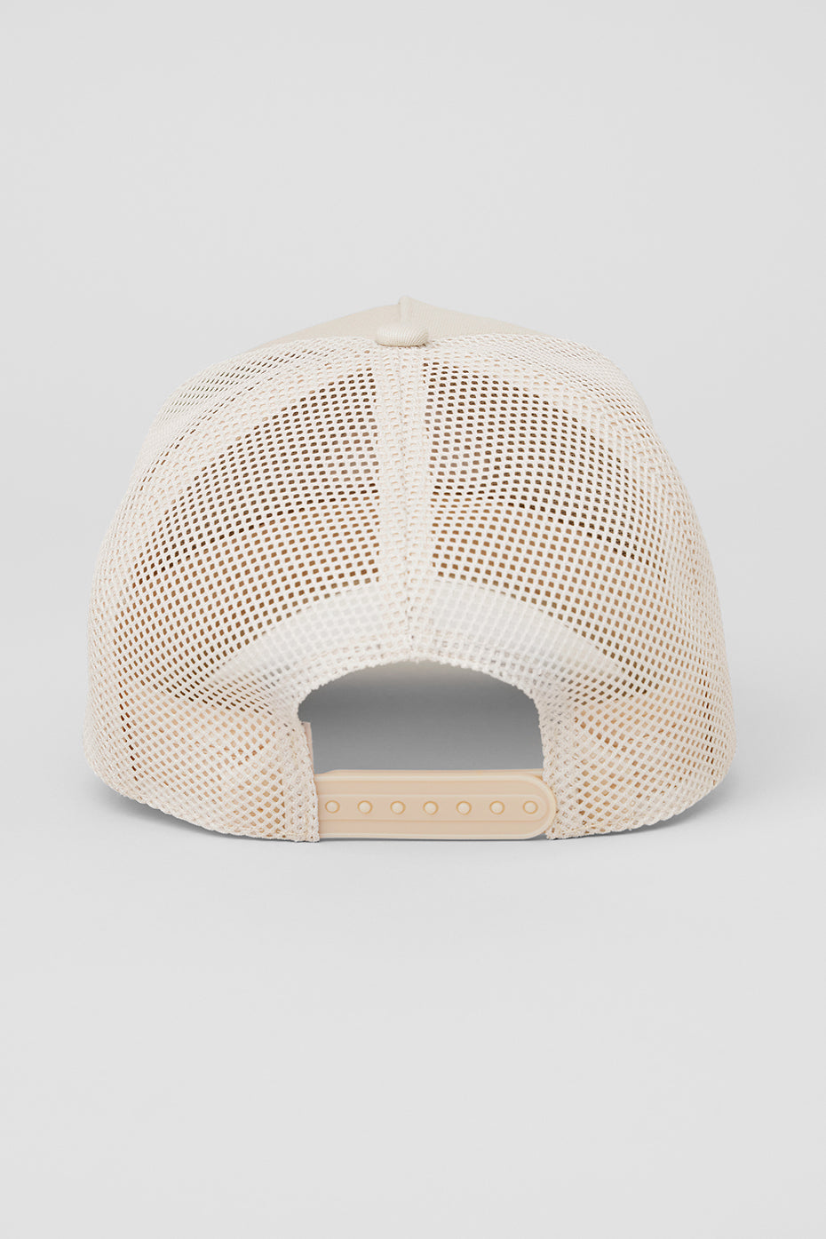 Close-up of the embroidered logo on the Elevated District Trucker Hat.