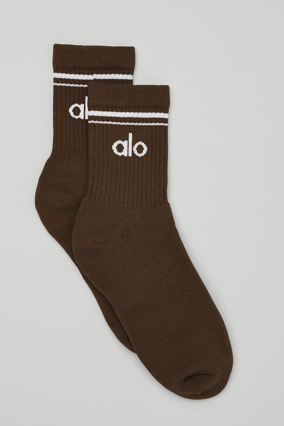 Espresso and white retro crew socks displayed on a wooden surface.