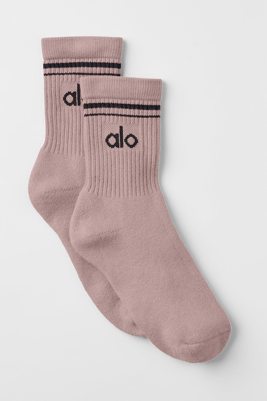 Unisex half-crew socks with stripes in taupe and black on a model's feet