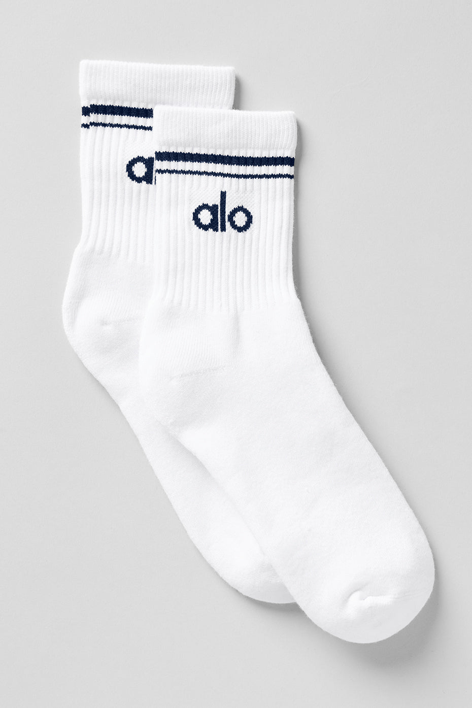 Close-up of classic unisex half-crew comfort socks in white and navy.