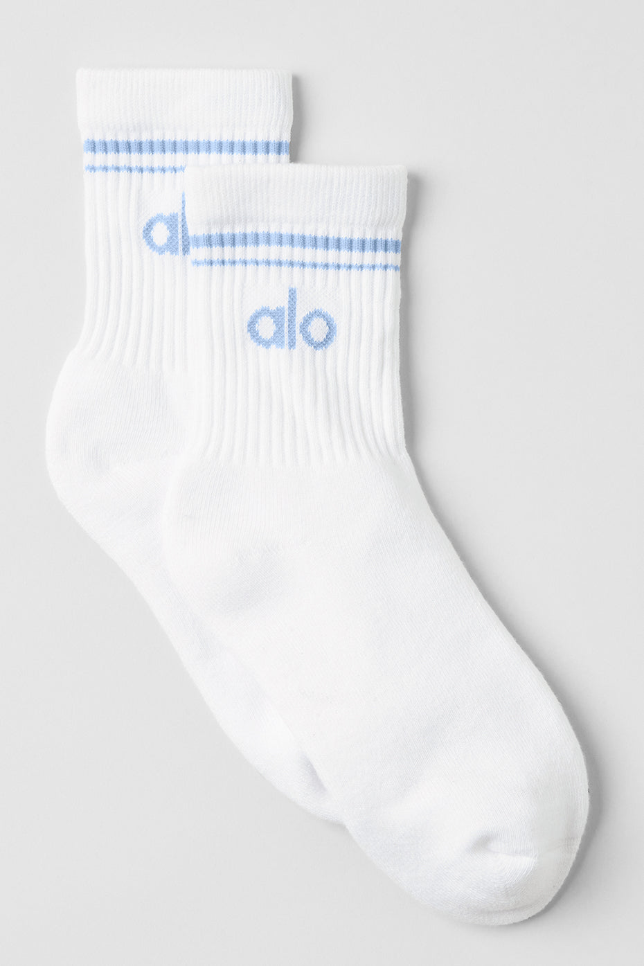 White crew socks styled with sneakers for a casual look