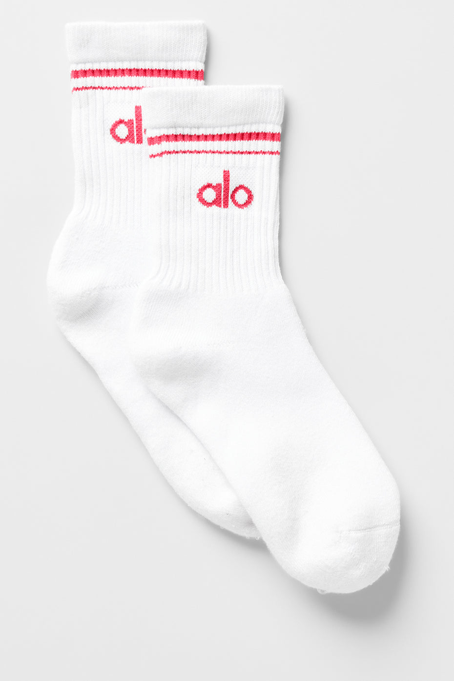 Close-up of retro crew socks in white and candy red, showcasing the stripe detail.