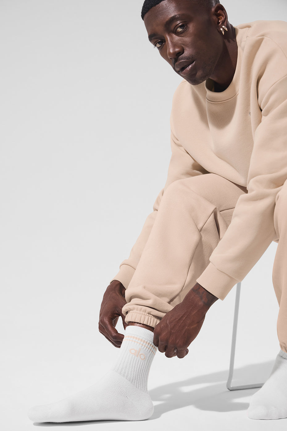 Flat lay of Classic Unisex Half-Crew Throwback Socks in White and Macadamia.