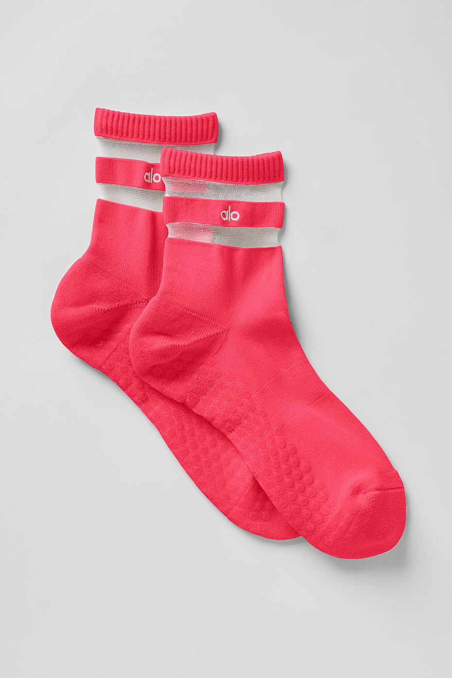 Close-up of Candy Red women's grip socks showcasing the cushioned toes and heels.