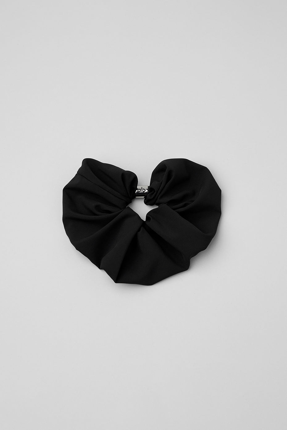 Close-up of the black scrunchie with bead detail, showcasing its texture.
