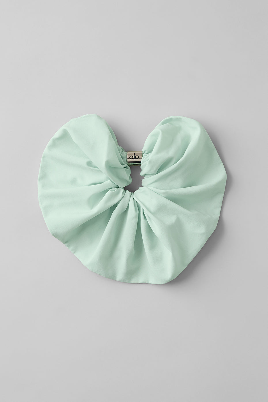 Oversized scrunchie in spearmint with a silver bead, perfect for thick hair styles.