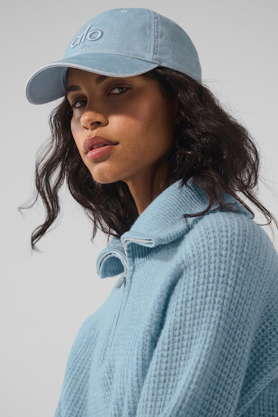 Side view of vintage denim dad hat on wooden bench