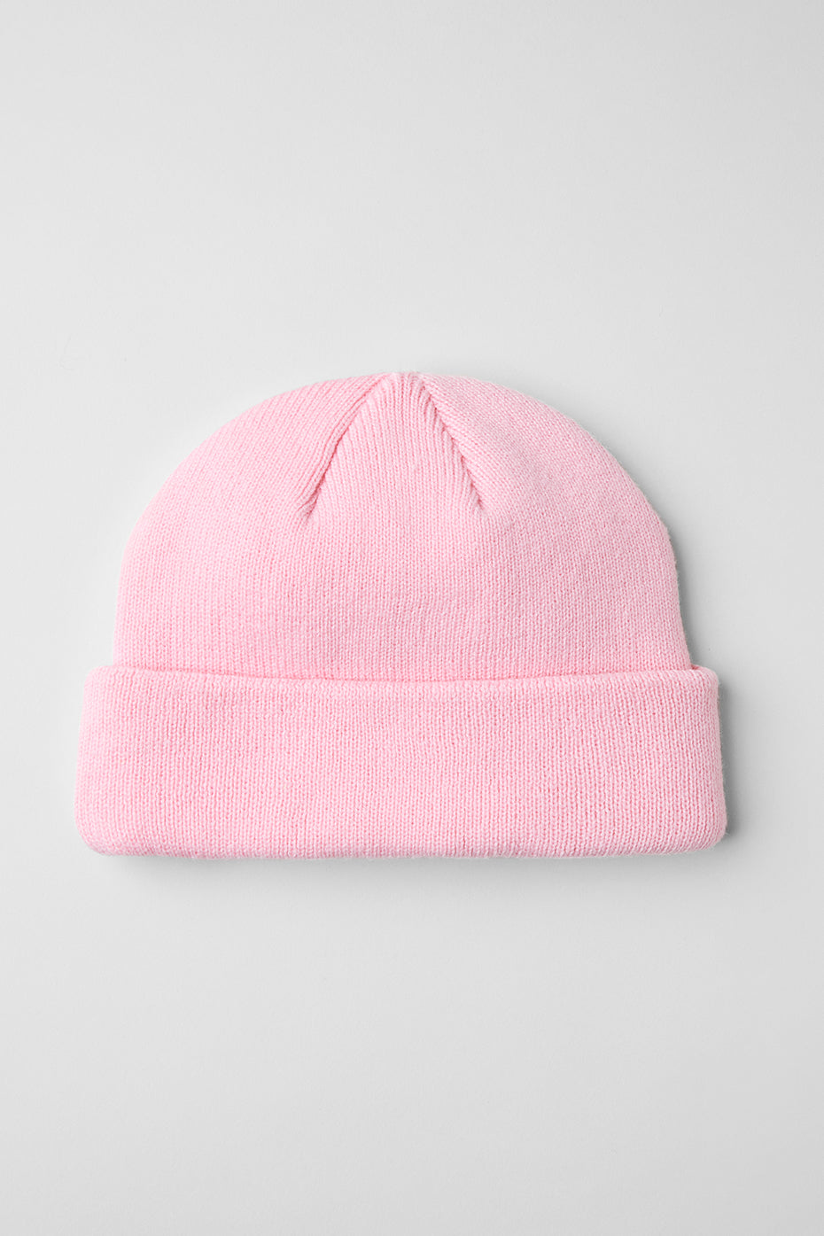 Close-up of the ribbed fabric and cozy material of the winter beanie in pink