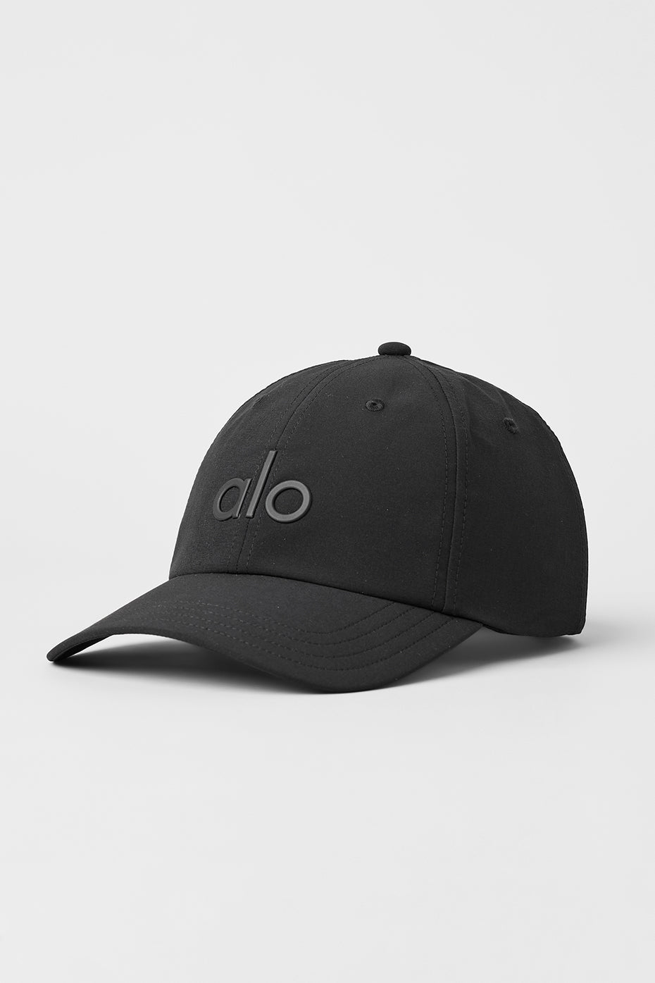 Front view of a black performance off-duty cap with curved brim and adjustable strap