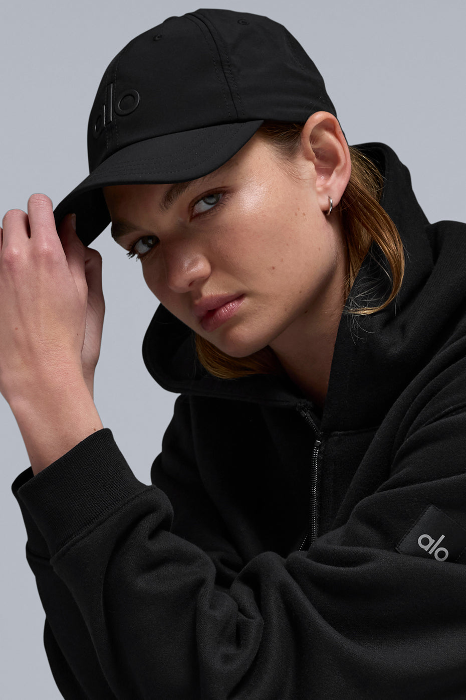 Side angle of a sweat-wicking hat showing breathable fabric and fit adjustment