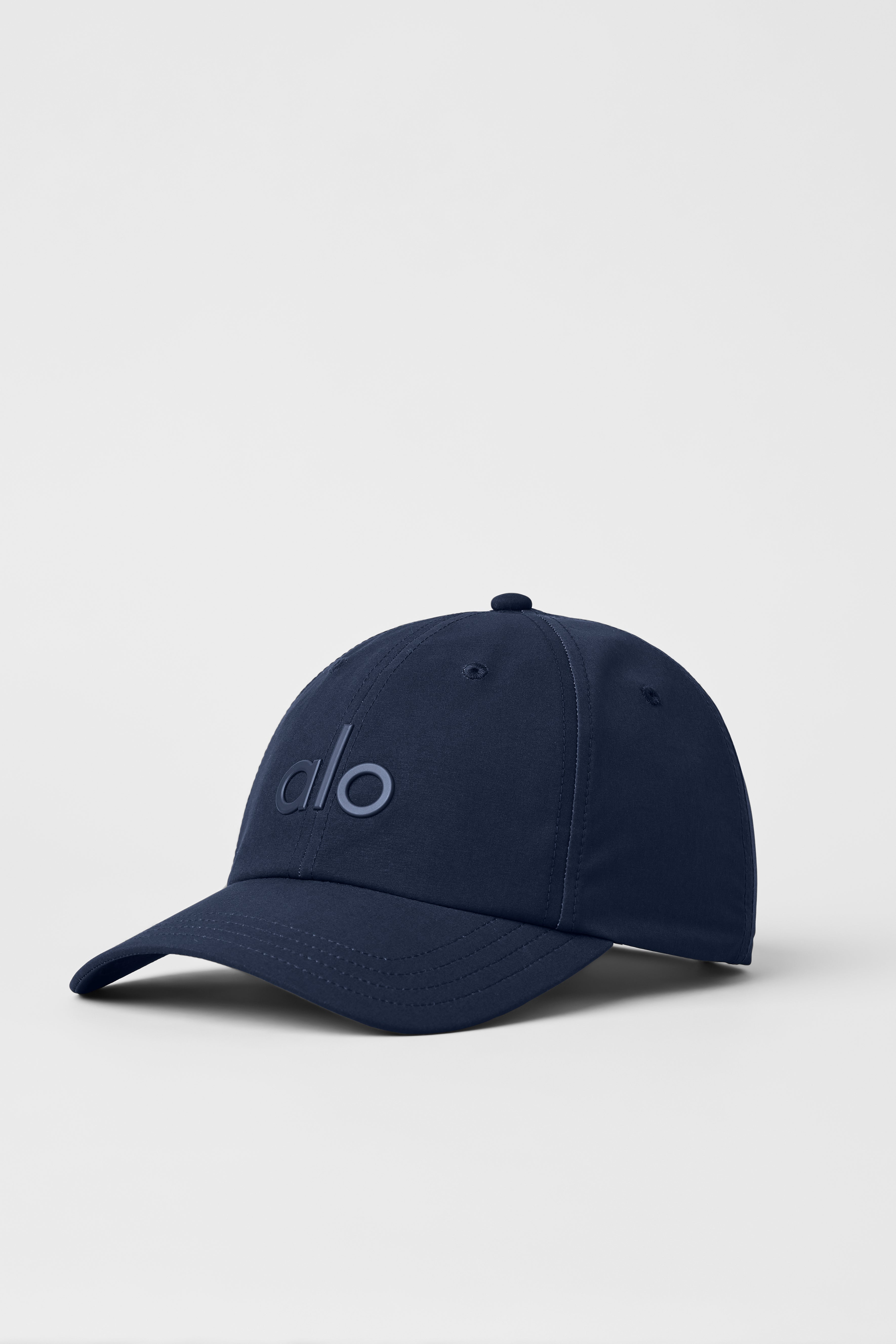 Front view of navy performance cap with adjustable strap for comfort.