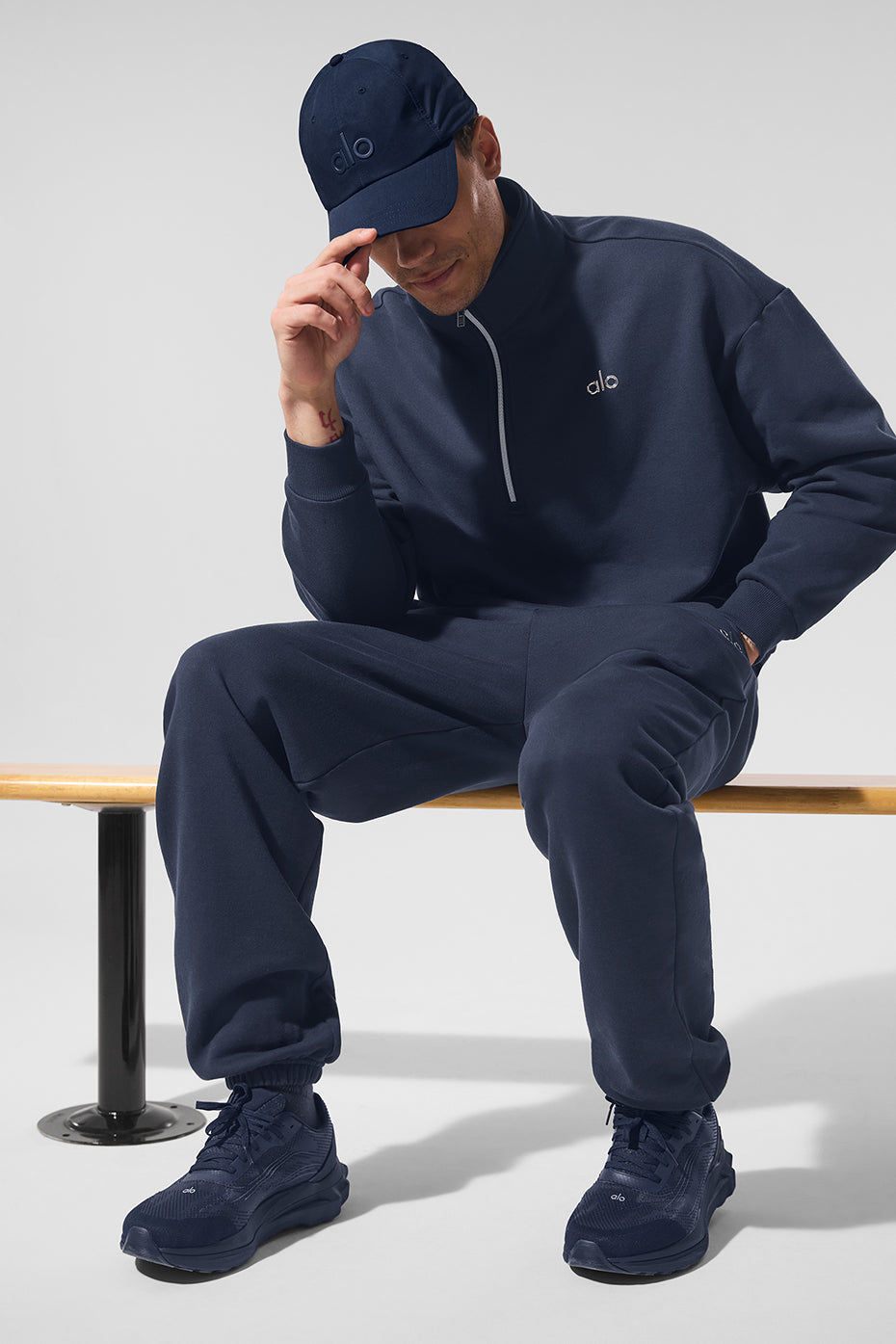 Front view of navy performance cap with adjustable strap for comfort.