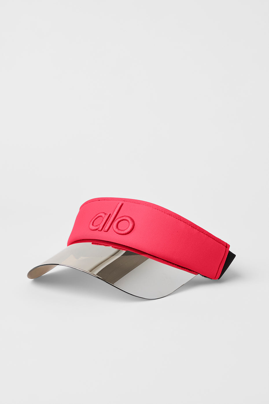 Close-up of the candy red tennis visor showcasing its holographic brim.