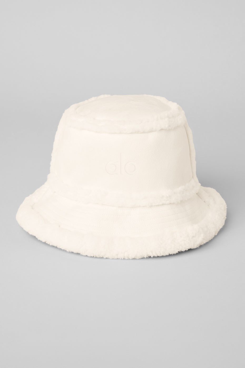 Close-up of the soft sherpa lining inside the ivory bucket hat.