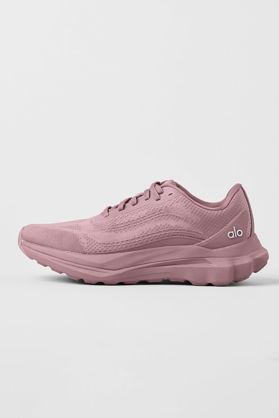 ALO Runner performance sneakers side view on urban pavement