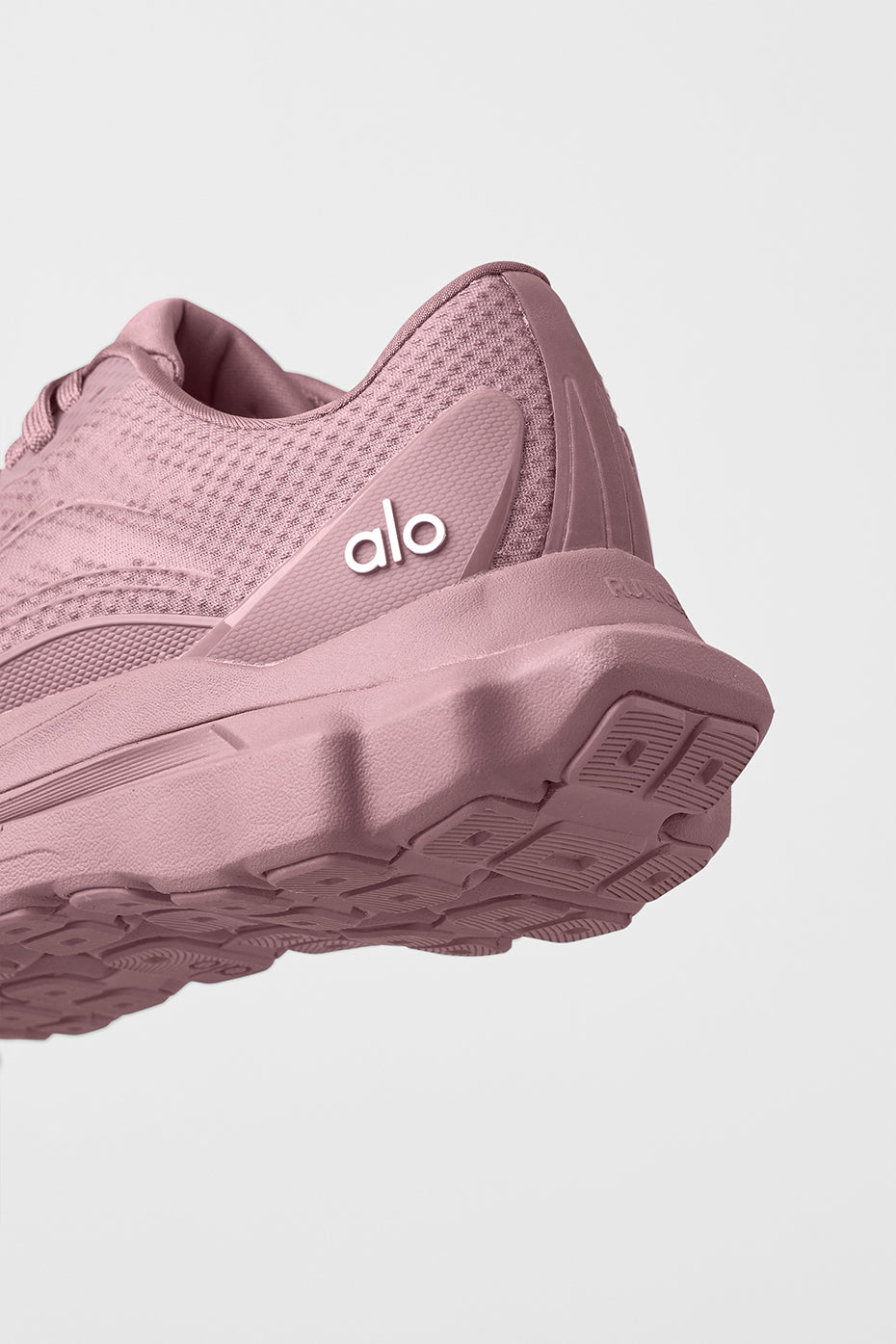 ALO Runner stability heel clip detail during trail run