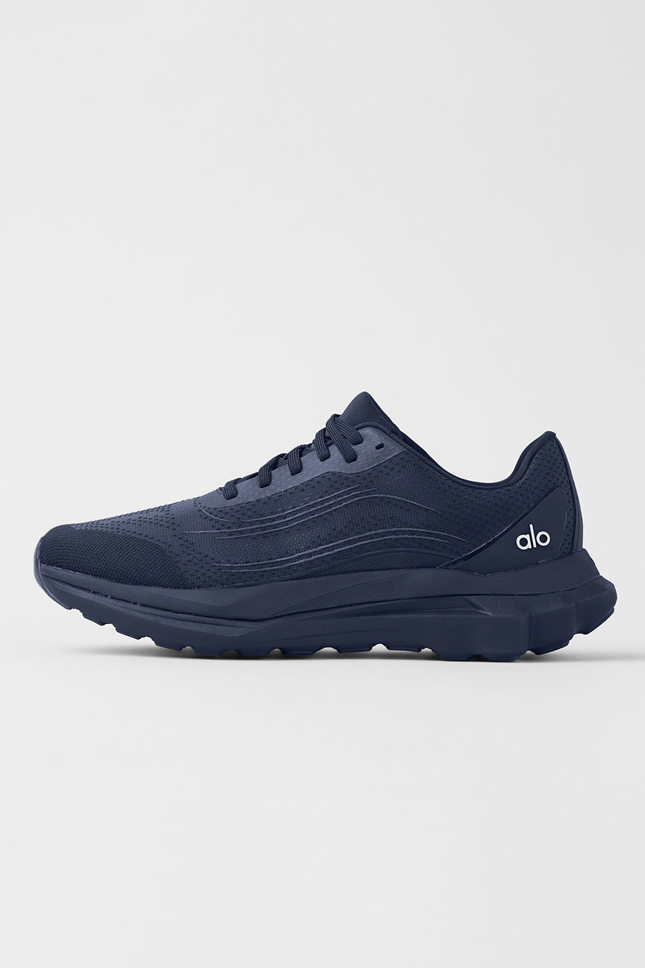 ALO Performance Runner shoes viewed from the side, highlighting the stabilizing heel clip.