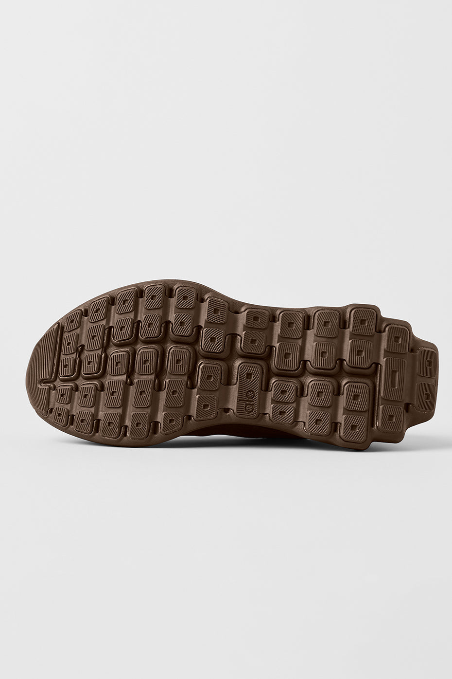 Close-up of the heel clip and cushioning of ALO Runner - Espresso for support during outdoor activities