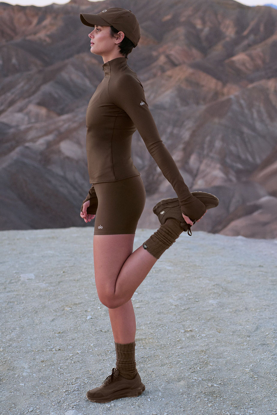 Side view of ALO Runner - Espresso highlighting the dual-density midsole for stability