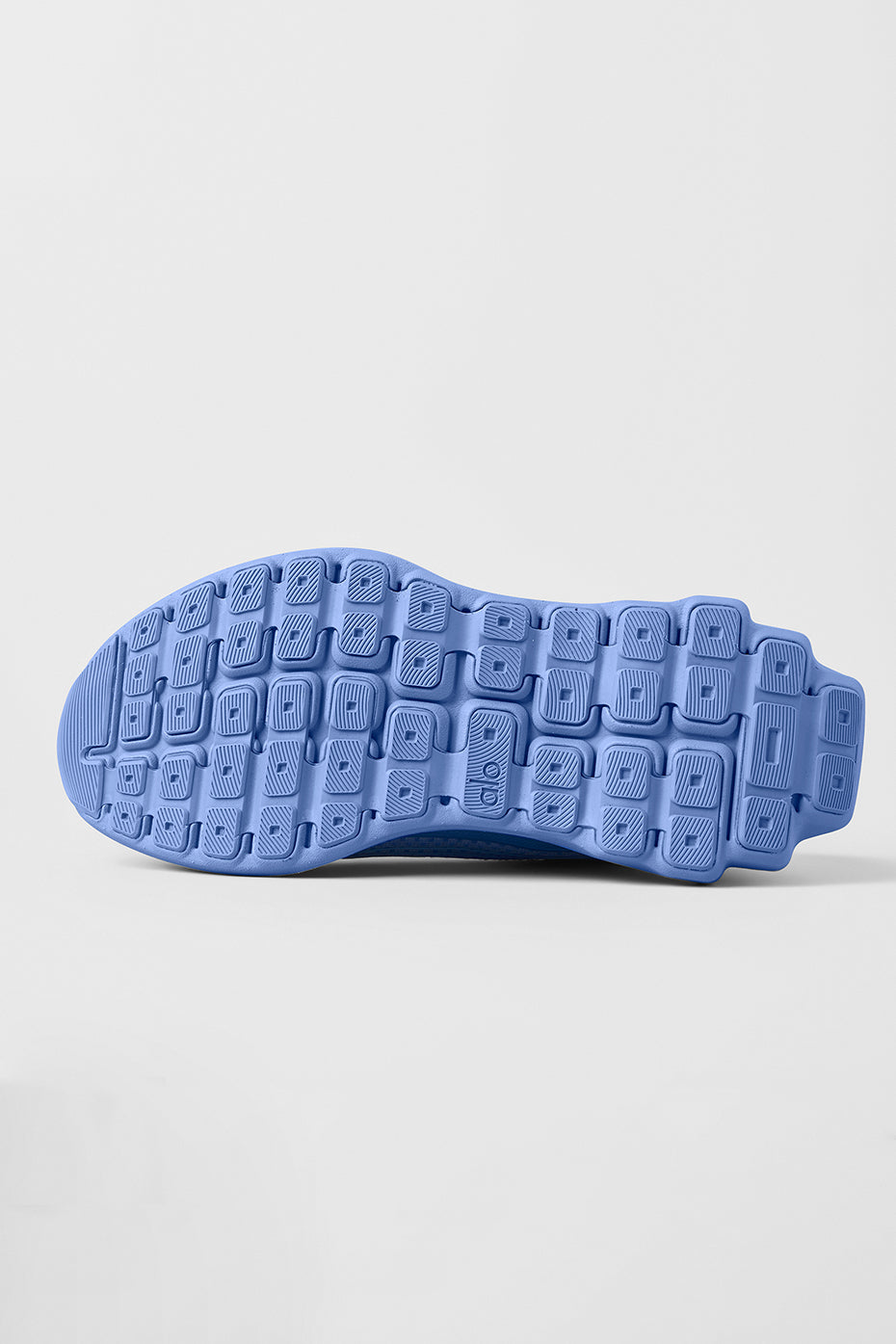 Side view of ALO Runner performance footwear, highlighting the stabilizing heel clip.