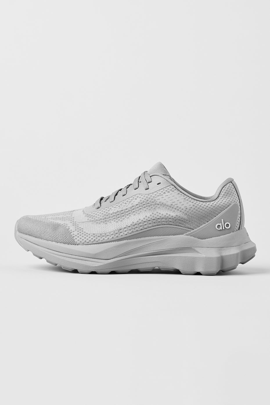Side view of ALO Runner performance sneakers in grey, showcasing breathable mesh.