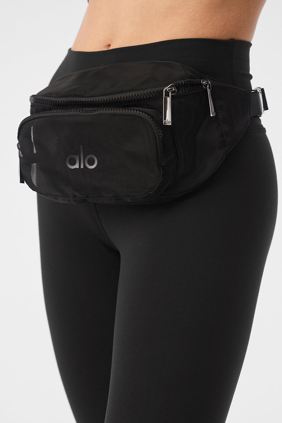 Front view of the transparent mesh fanny pack, showcasing its spacious compartments.